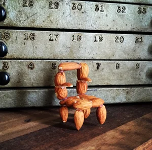 A miniature chair assembled from almonds
