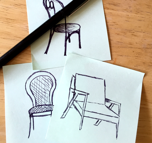 Pen drawings of three chairs on small sheets of paper